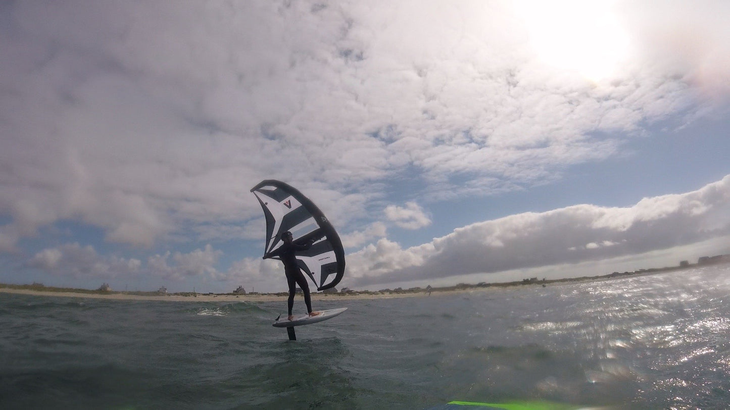 Wing foiling lessons Kite Surfing Lessons to end foiling lessons with surf to summit El Medano South Tenerife