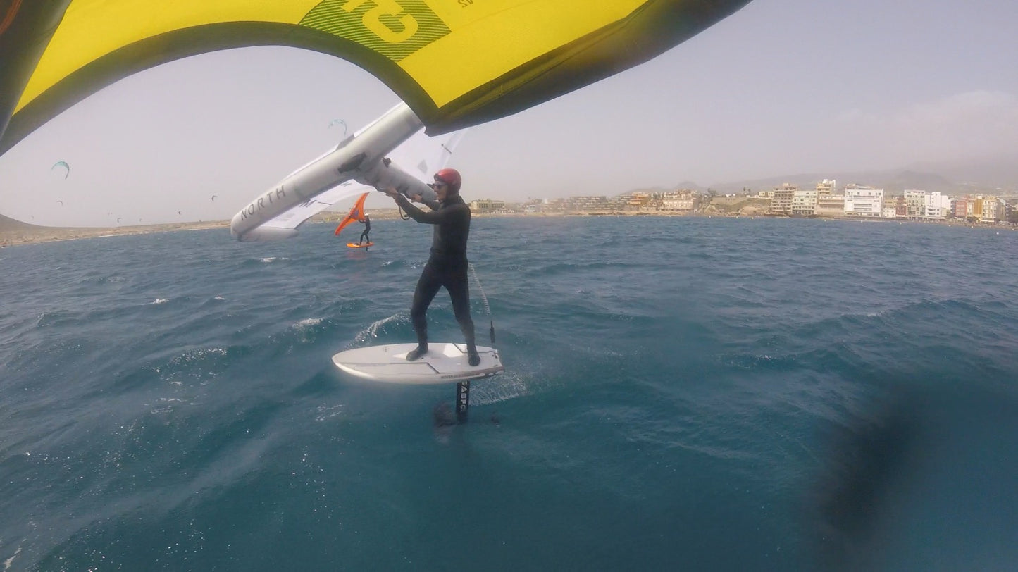Wing Foil is down winding with surf to Summit