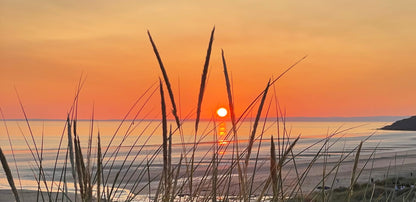 Sunset after toe foiling session with surf to Summit location, new Brighton
