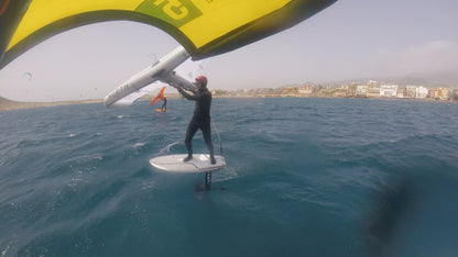Wing Foil is down winding with surf to Summit