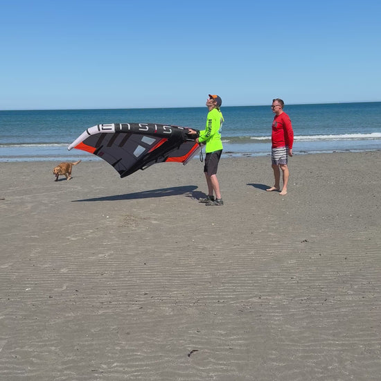 Understanding how the Wing works with hydrofoil to foiling instructor safe to summit with student on beach