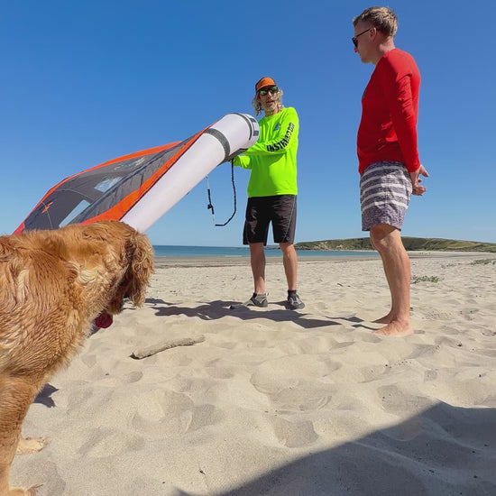 Surf to Summit instructor with students and Grace on the beach
