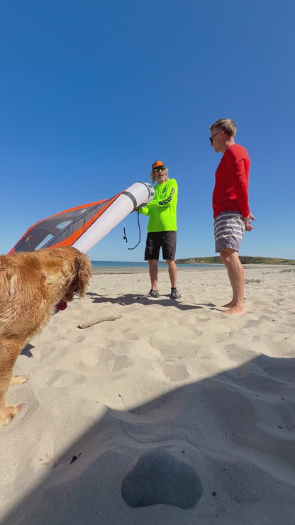Surf to Summit instructor with students and Grace on the beach